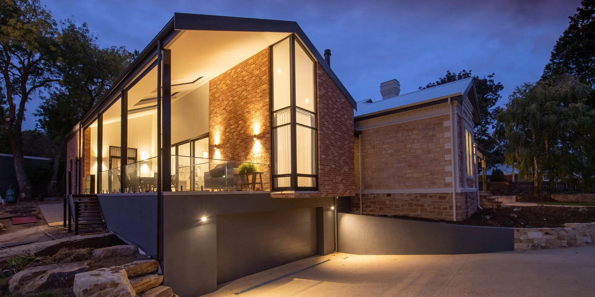 Modern glazed brick home at dusk